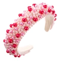 Détail d'un serre-tête éponge rose et rouge orné de perles colorées et d'une doublure en velours - Rose