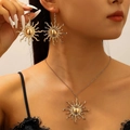 Golden sunflower statement earring and necklace set displayed on a model - Sun Motif Jewelry Set (Earrings + Necklace)