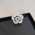 Translucent white camellia flower hair claw clip with a matte resin finish on a tray - Flower Shape / Camellia Jelly Apricot