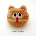Close-up of orange plush cat head with embroidered eyes and dimensions 6cm x 6.5cm - Original with Back Opening / Brown