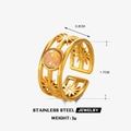 Gold stainless steel ring with pink round stone and starburst hollow patterns - Rose Quartz