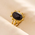 Detail view of adjustable gold ring with black marble stone and beaded texture - Gold + Black