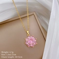 Close-up of sparkling pink zircon flower pendant with golden chain on silk fabric - Gold Chain Pink Flower Pendant (F152)