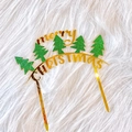 Detail of golden mirror acrylic cake topper with green glitter Christmas tree - Christmas Tree Arch Merry Christmas
