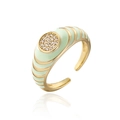 Macro detail of gold-plated geometric ring with mint green enamel and white zircons - Pale Green