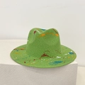 Detail showing hand-painted multicolor graffiti spray on a green straw panama hat - M / Green (Graffiti Splatter)