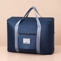 Dark blue travel bag with diamond quilted pattern and gray handles for easy carrying - Navy Blue