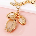 Golden tulip keychain with opal cat eye stones and sparkling crystals for handbags - Three White Tulips