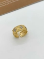 Macro detail of Italian brushed gold ring featuring sparkling star-shaped engravings - Ring