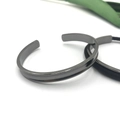 Minimalist gunmetal grey stainless steel open cuff bracelet with sleek metal texture - Arc Steel Color