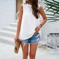 Chic sleeveless white shirt with lace stitching paired with ripped denim shorts - S / White