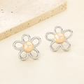 Macro shot of silver hollow floral earrings with champagne pearl center on stone - 26*25mm / Steel Hollow Style (KE115785-GC)