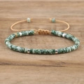 Macro detail of natural imperial stone beads and silver spacers on adjustable woven bracelet - No.15 Green Spot Stone