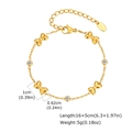 Détail du bracelet noeud doré avec zircone et poinçon K18 sur la chaîne d'extension - Adulte-Nœud Zircone (BR-2194G02) / Or