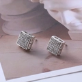 Macro shot of silver square stud earrings with pave-set cubic zirconia on an elegant background - D19 Silver Hollow Square