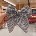 Elegant black and white checkered bow hair clip with textured woven fabric for women - Gingham / Black