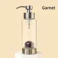 Glass lotion dispenser with purple garnet crystals and brushed metal pump head - Garnet