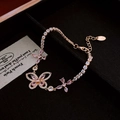 Elegant gold butterfly bracelet featuring pink crystals and zircons on black velvet - 7# Bracelet-Gold-Pink