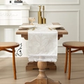 White jacquard table runner with leaf pattern and elegant tassels on a wooden table - 35*120cm / Milky White