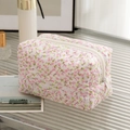 Quilted floral makeup bag with pink cherry blossom pattern and white zipper closure - New Pink Floral