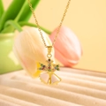 Gold angel necklace with pink enamel bells and colorful zircon stones on a gold chain - White Christmas Bell / Gold