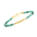 Close-up of green faceted beads and gold-plated spacers on a fine adjustable bracelet - Green Flash Snowflake Plate