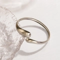 Minimalist silver stainless steel open bangle with unique asymmetric water drop design - Silver Streamline Teardrop