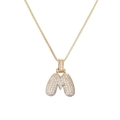 Detailed close-up of a gold M-shaped pendant necklace encrusted with white sparkling zircons - Letter M