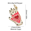Macro view of a 25mm red palm pendant with gold trim and a heart for DIY jewelry - Red Enamel Heart Hamsa Palm Charm