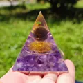 Handheld amethyst orgone pyramid featuring crystal ball and golden spiral details - K-4-4 Amethyst Coil Pyramid / 5cm