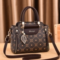 Deep coffee printed handbag with Daiziya metal logo and gold leaf charm accessory - Coffee & Brown