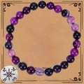 Detail of purple striped agate bead bracelet with compass charm on gift card - Purple Striped Agate Bracelet