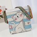 Striped canvas crossbody bag with cat embroidery and a colorful geometric woven strap - Blue Cat Pattern