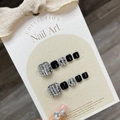 Elegant black and silver press-on toenails with sparkling rhinestone accents in minimalist style - Large L (B15)