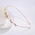 Elegant gold metal headband featuring rhinestones, butterflies, and hearts on a tea cup - Bowknot with Heart Rhinestone