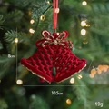 Red flocked Christmas bell pendant with gold glitter bow and holiday tree backdrop - Red Flocked Flat Double Bells