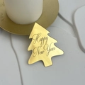 Close-up of golden acrylic Christmas tree cake topper with Happy New Year engraving - Christmas Tree Happy New Year Style 1 / Gold