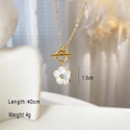 Macro detail of golden flower pendant necklace with OT toggle clasp and size dimensions - Gold - OT Buckle Shell Flower Necklace