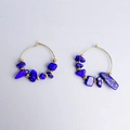 Detail of bohemian hoop earrings with blue natural stones and gold metal beads - Lapis Lazuli