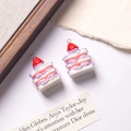 Detail of handmade resin strawberry cake pendants for DIY jewelry and keychains - Purple White + White Filling