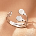 Close-up of double-layered stainless steel ring with three milgrain textured silver disks - Silver Triple Disc (C1448)