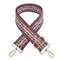 Detailed view of the woven ethnic pattern on the burgundy and beige wide shoulder bag strap - Gold Buckle / Dark Purple Small Flower