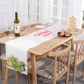 Cream linen Christmas table runner featuring red Party text and festive ornaments - 08-Christmas Party Beige