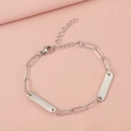 Close-up of polished stainless steel paperclip chain bracelet with engravable tags - 2 Bars / Steel