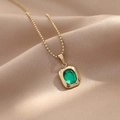 Retro gold beaded chain necklace with oval green gemstone pendant on champagne satin - 14K Gold-Green Zirconia
