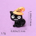 Close-up of black cat resin charm with orange wizard hat and specific measurements - Black Cat with Orange Hat