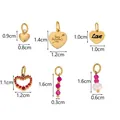 Detail view of heart-shaped pendants with happy Valentine's day engraving and pink gems - TZ00043B-1 (Red Zirconia/Pink Bead Set)