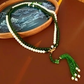 Detailed view of dual-strand pearl and green jade bead necklace with long tassels - Green-White