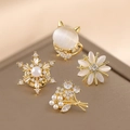 Elegant four-piece brooch set with opal cat, pearl snowflake, and golden flower pins - Fashion 4-Piece Set