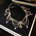 Detail of a multi-layer silver necklace with rhinestones and pearls in a black jewelry box - Silver Rhinestone Waterdrop Necklace